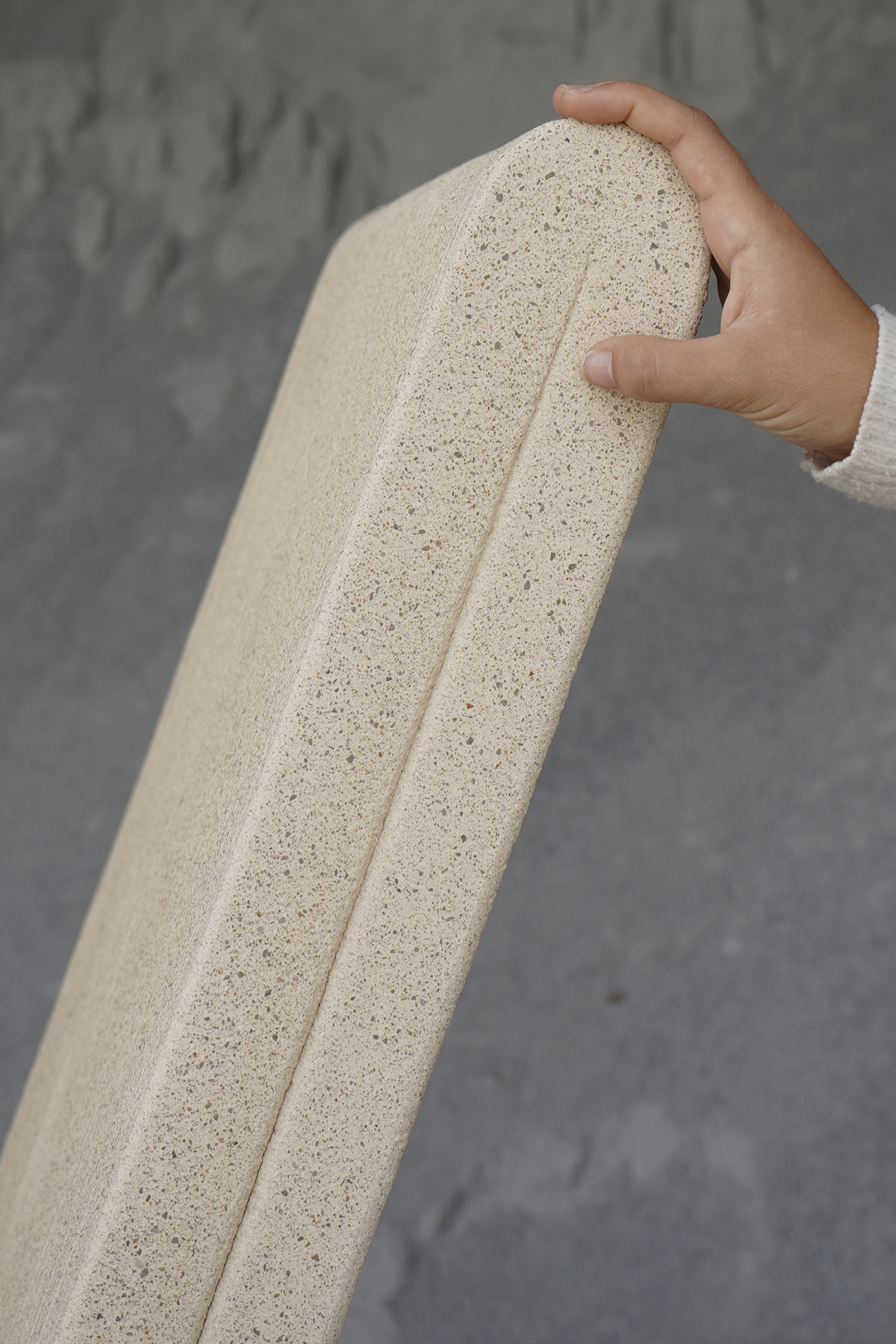 The burnished finish reveals the texture of the aggregate.